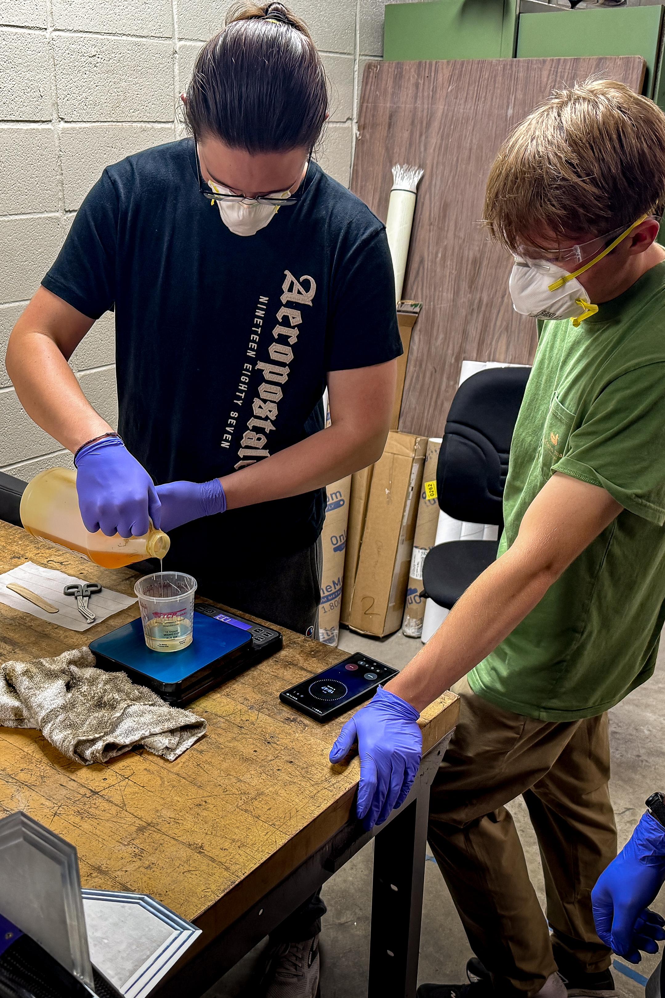 Measuring out epoxy in the shop