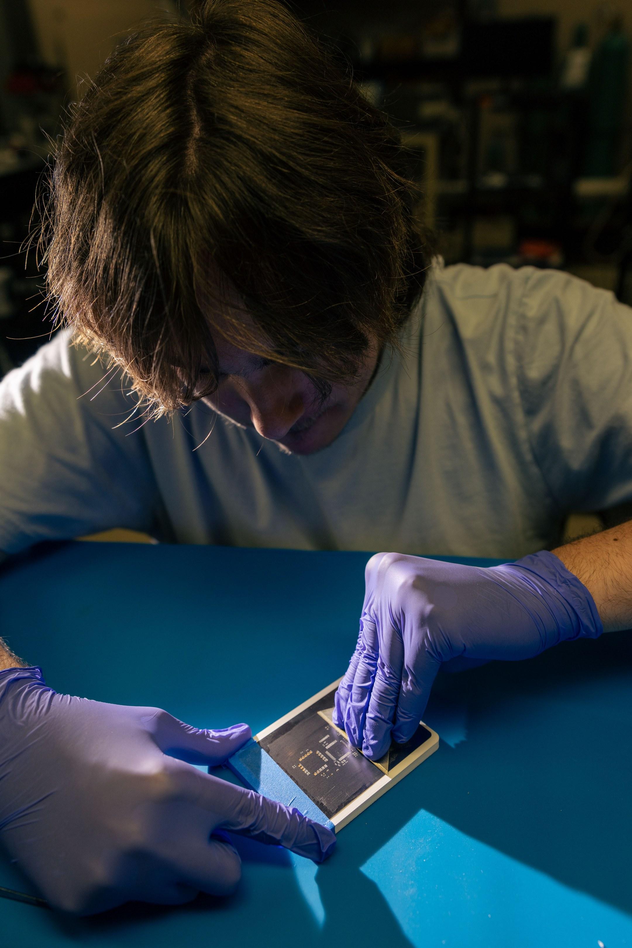 Applying solder paste through a stencil