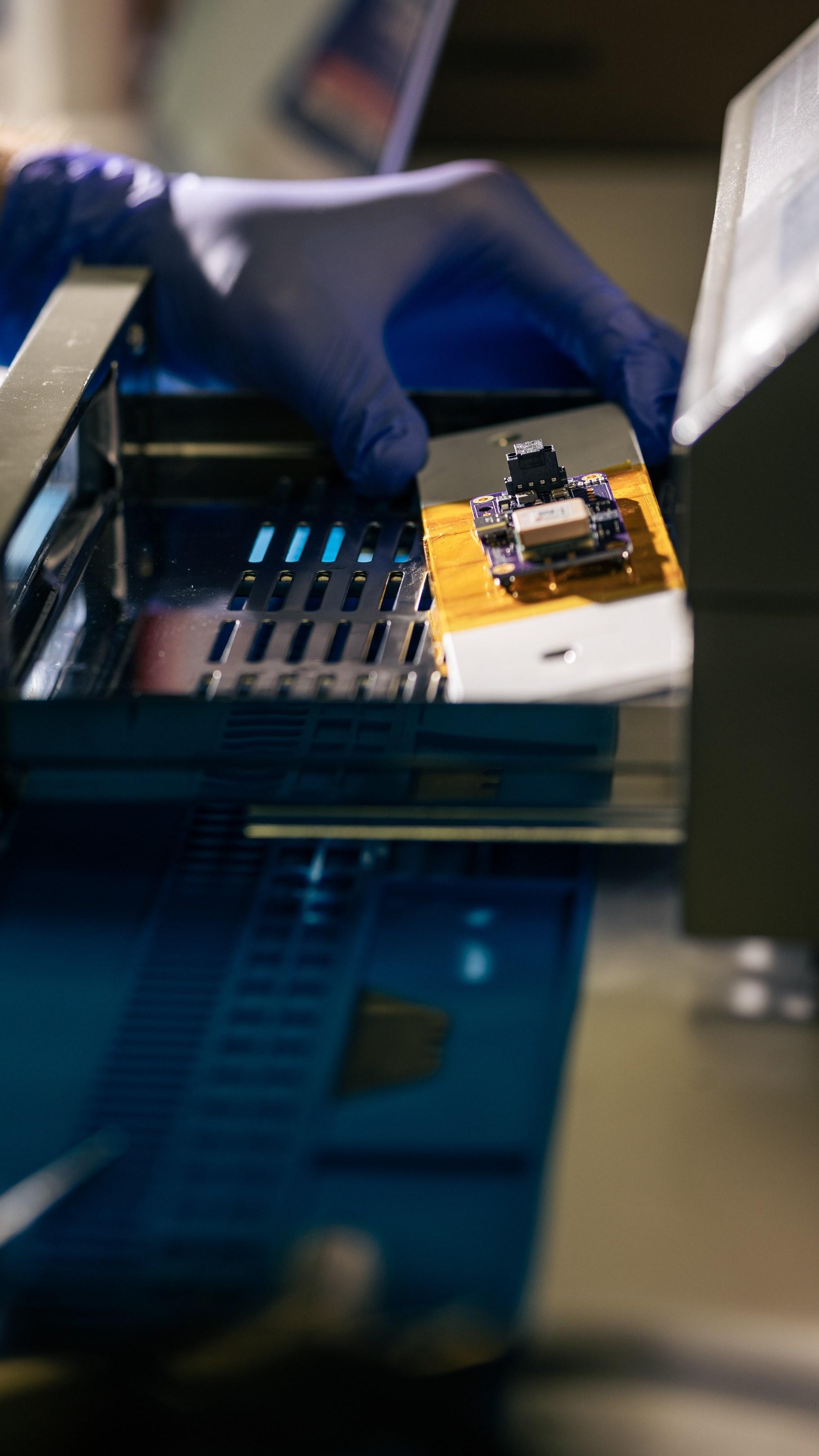 Loading a board into the reflow oven